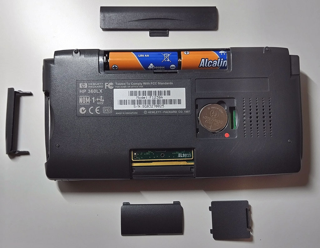 Photograph of the open slots and compartments of a HP 360LX